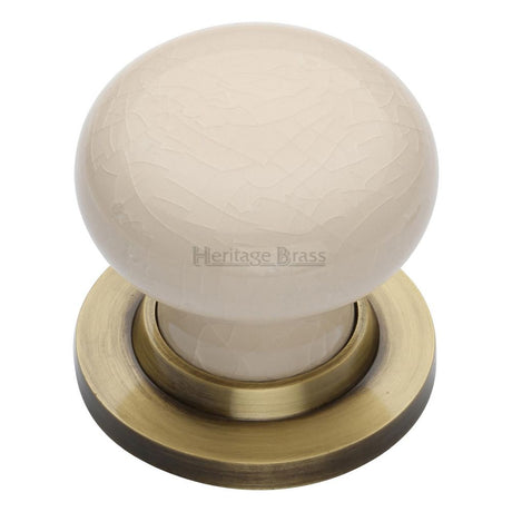 This is an image of a Heritage Brass - Cream Crackle Knob with Antique Brass base, 8010-at that is available to order from Trade Door Handles in Kendal.