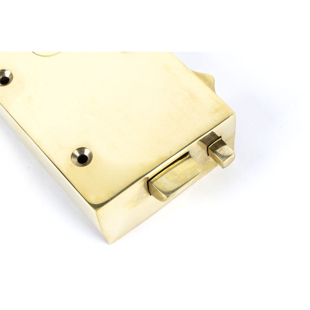 This is an image showing From The Anvil - Polished Brass Left Hand Bathroom Latch available from trade door handles, quick delivery and discounted prices