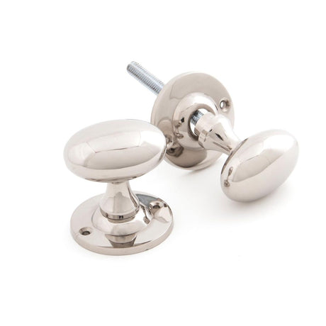 This is an image showing From The Anvil - Polished Nickel Oval Mortice/Rim Knob Set available from trade door handles, quick delivery and discounted prices