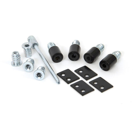 This is an image showing From The Anvil - Black Secure Stops (Pack of 4) available from trade door handles, quick delivery and discounted prices