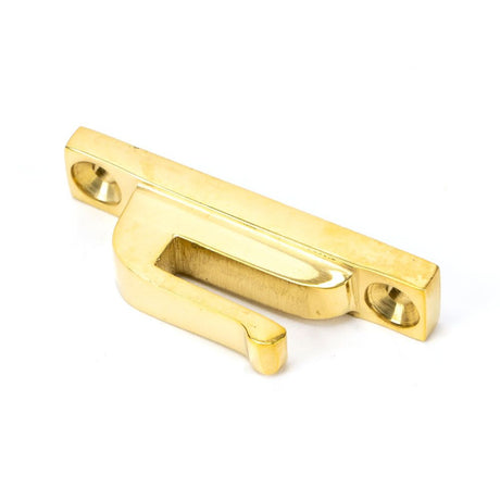 This is an image showing From The Anvil - Polished Brass Hook Plate available from trade door handles, quick delivery and discounted prices