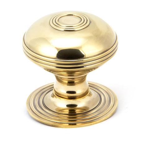 This is an image showing From The Anvil - Aged Brass Prestbury Centre Door Knob available from trade door handles, quick delivery and discounted prices