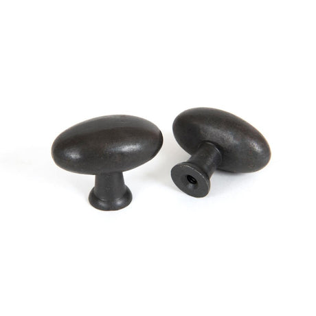 This is an image showing From The Anvil - Beeswax Oval Cabinet Knob available from trade door handles, quick delivery and discounted prices