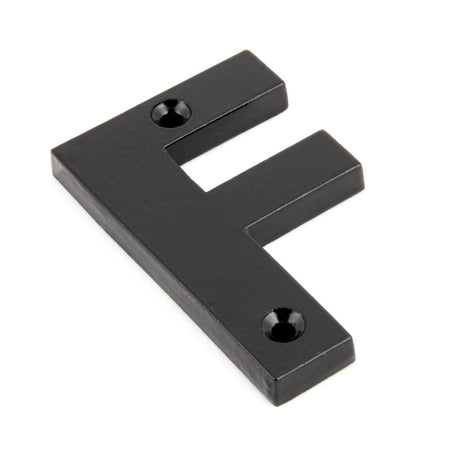 This is an image showing From The Anvil - Black Letter F available from trade door handles, quick delivery and discounted prices