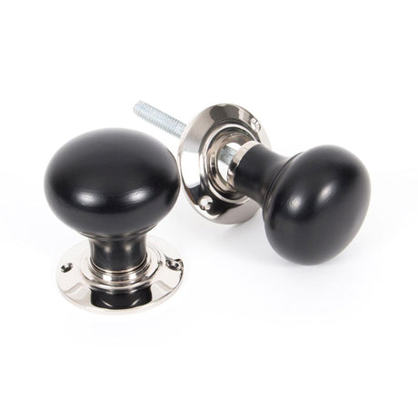 This is an image showing From The Anvil - Ebony and PN Bun Mortice/Rim Knob Set available from trade door handles, quick delivery and discounted prices