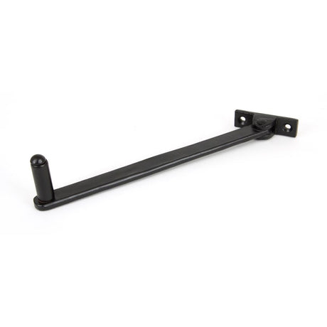 This is an image showing From The Anvil - Black 8" Roller Arm Stay available from trade door handles, quick delivery and discounted prices