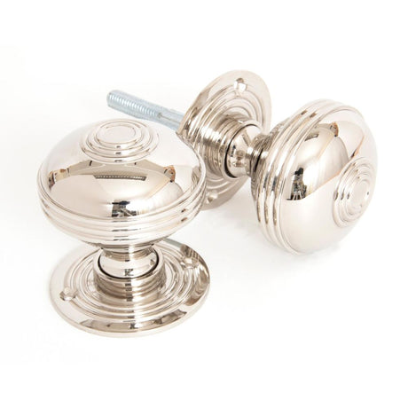 This is an image showing From The Anvil - Polished Nickel 63mm Prestbury Mortice/Rim Knob Set available from trade door handles, quick delivery and discounted prices