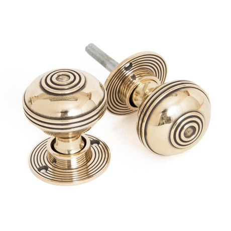 This is an image showing From The Anvil - Aged Brass 50mm Prestbury Mortice/Rim Knob Set available from trade door handles, quick delivery and discounted prices