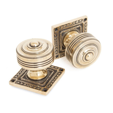 This is an image showing From The Anvil - Aged Brass Tewkesbury Square Mortice Knob Set available from trade door handles, quick delivery and discounted prices
