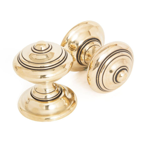 This is an image showing From The Anvil - Aged Brass Elmore Concealed Mortice Knob Set available from trade door handles, quick delivery and discounted prices