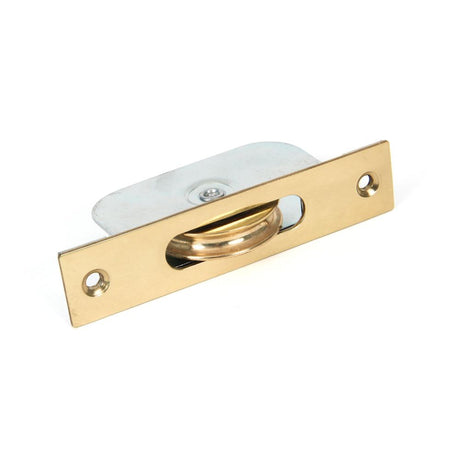 This is an image showing From The Anvil - Lacquered Brass Square Ended Sash Pulley 75kg available from trade door handles, quick delivery and discounted prices