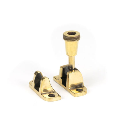 This is an image showing From The Anvil - Aged Brass Brompton Brighton Fastener (Radiused) available from trade door handles, quick delivery and discounted prices