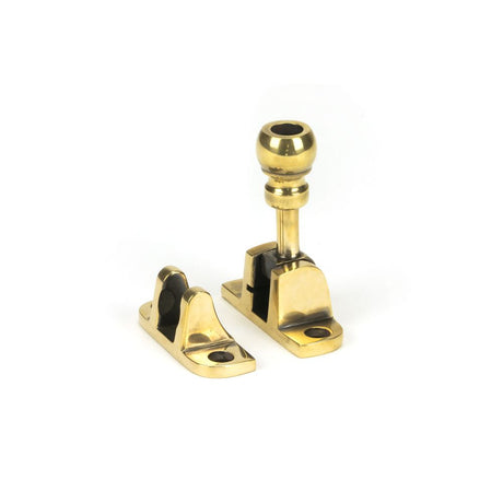 This is an image showing From The Anvil - Aged Brass Mushroom Brighton Fastener (Radiused) available from trade door handles, quick delivery and discounted prices