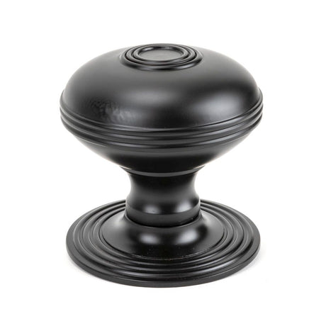 This is an image showing From The Anvil - Aged Bronze Prestbury Centre Door Knob available from trade door handles, quick delivery and discounted prices
