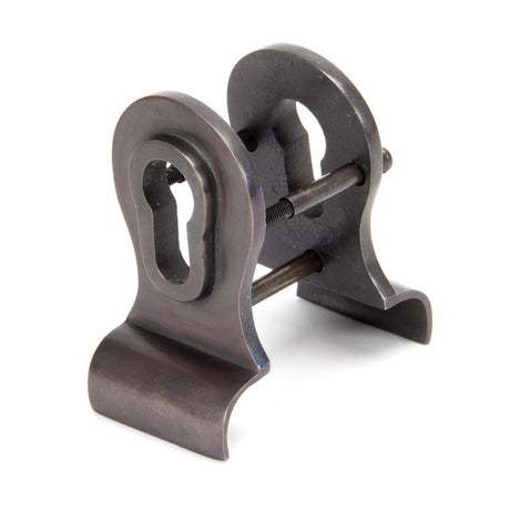 This is an image showing From The Anvil - Aged Bronze 50mm Euro Door Pull (Back to Back fixings) available from trade door handles, quick delivery and discounted prices
