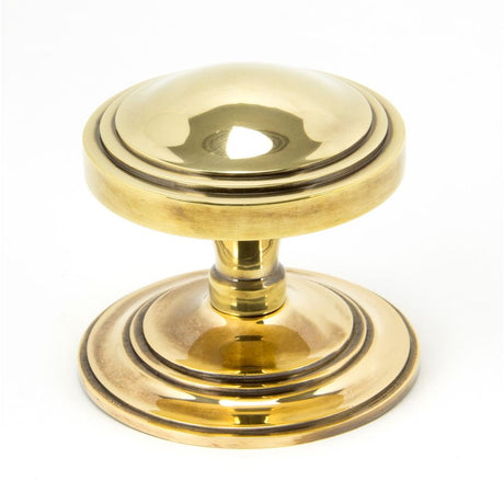This is an image showing From The Anvil - Aged Brass Art Deco Centre Door Knob available from trade door handles, quick delivery and discounted prices