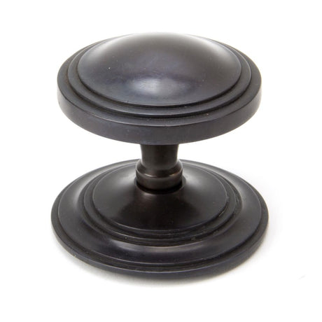 This is an image showing From The Anvil - Aged Bronze Art Deco Centre Door Knob available from trade door handles, quick delivery and discounted prices