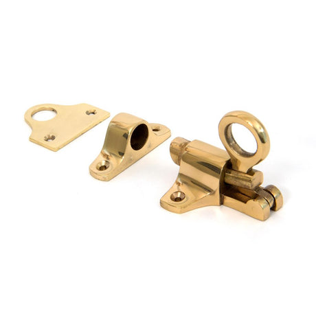 This is an image showing From The Anvil - Lacquered Brass Fanlight Catch + Two Keeps available from trade door handles, quick delivery and discounted prices