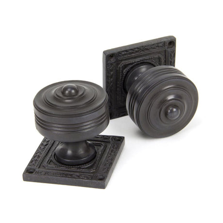 This is an image showing From The Anvil - Aged Bronze Tewkesbury Square Mortice Knob Set available from trade door handles, quick delivery and discounted prices
