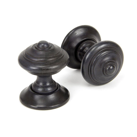 This is an image showing From The Anvil - Aged Bronze Elmore Concealed Mortice Knob Set available from trade door handles, quick delivery and discounted prices