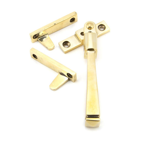 This is an image showing From The Anvil - Aged Brass Night-Vent Locking Avon Fastener available from trade door handles, quick delivery and discounted prices