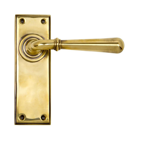 This is an image showing From The Anvil - Aged Brass Newbury Lever Latch Set available from trade door handles, quick delivery and discounted prices