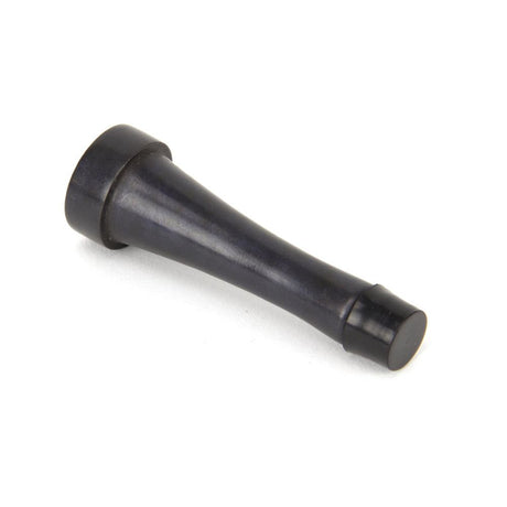 This is an image showing From The Anvil - Aged Bronze Projection Door Stop available from trade door handles, quick delivery and discounted prices
