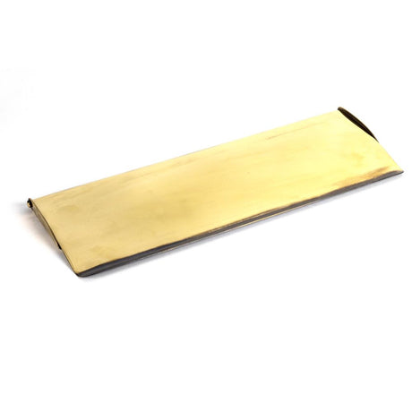 This is an image showing From The Anvil - Aged Brass Large Letter Plate Cover available from trade door handles, quick delivery and discounted prices