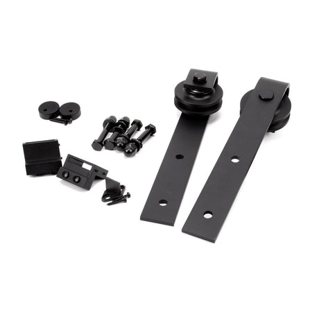 This is an image showing From The Anvil - Black Door Hanging Set for Sliding Door Kit available from trade door handles, quick delivery and discounted prices