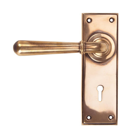 This is an image showing From The Anvil - Polished Bronze Newbury Lever Lock Set available from trade door handles, quick delivery and discounted prices