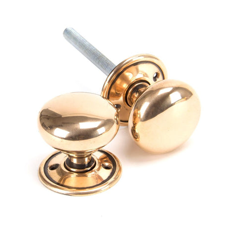 This is an image showing From The Anvil - Polished Bronze Mushroom Mortice/Rim Knob Set available from trade door handles, quick delivery and discounted prices