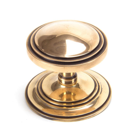 This is an image showing From The Anvil - Polished Bronze Art Deco Centre Door Knob available from trade door handles, quick delivery and discounted prices