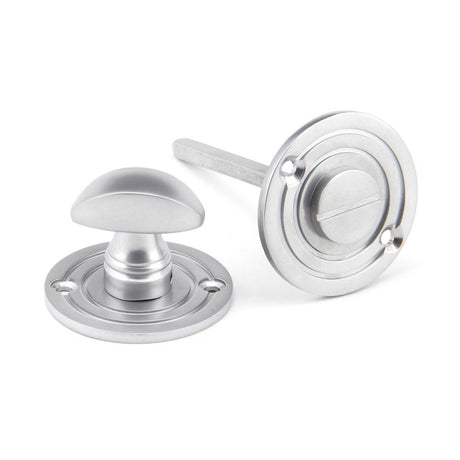 This is an image showing From The Anvil - Satin Chrome Round Bathroom Thumbturn available from trade door handles, quick delivery and discounted prices