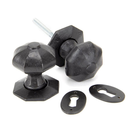 This is an image showing From The Anvil - External Beeswax Octagonal Mortice/Rim Knob Set available from trade door handles, quick delivery and discounted prices
