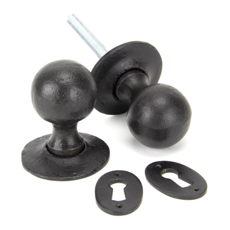 This is an image showing From The Anvil - External Beeswax Round Mortice/Rim Knob Set available from trade door handles, quick delivery and discounted prices