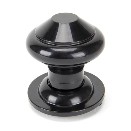 This is an image showing From The Anvil - Black Regency Centre Door Knob available from trade door handles, quick delivery and discounted prices