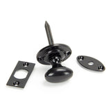 This is an image showing From The Anvil - Black Oval Rack Bolt available from trade door handles, quick delivery and discounted prices