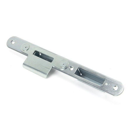 This is an image showing From The Anvil - BZP Winkhaus Centre Latch Keep RH 56mm Door available from trade door handles, quick delivery and discounted prices