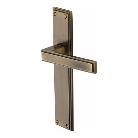This is an image of a Heritage Brass - Atlantis Long Lever Latch Antique Brass finish, atl6710-at that is available to order from Trade Door Handles in Kendal.