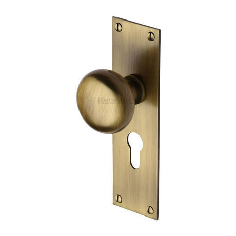 This is an image of a Heritage Brass - Mortice Knob on Euro Profile Plate Balmoral Design Antique Brass F, bal8548-at that is available to order from Trade Door Handles in Kendal.