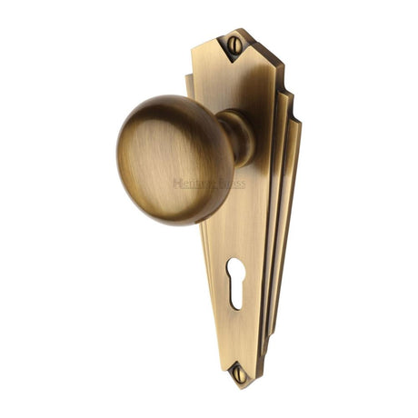 This is an image of a Heritage Brass - Mortice Knob on Lock Plate Broadway Design Antique Brass Finish, br1800-at that is available to order from Trade Door Handles in Kendal.