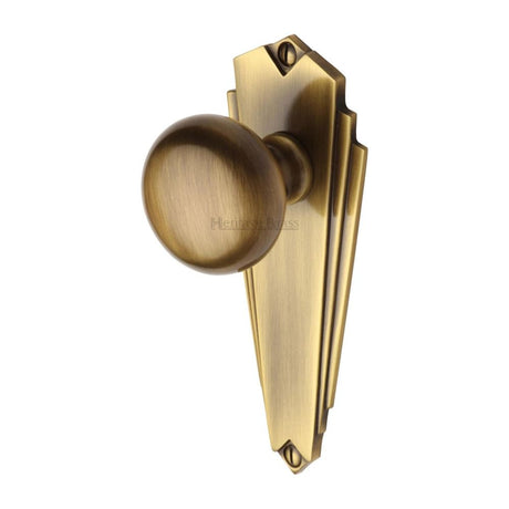 This is an image of a Heritage Brass - Mortice Knob on Latch Plate Broadway Design Antique Brass Finish, br1810-at that is available to order from Trade Door Handles in Kendal.