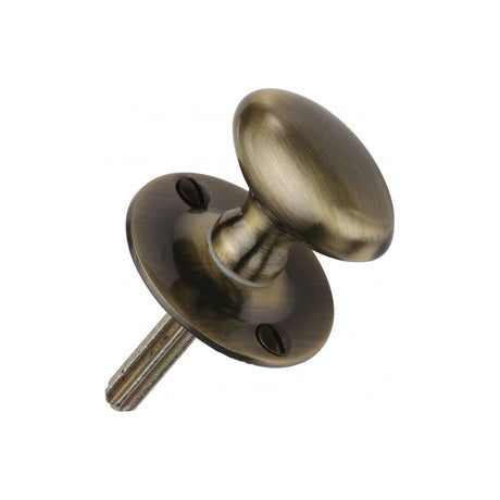 This is an image of a Heritage Brass - Oval Thumbturn w/o Bolt Antique Brass Finish, bt5-at that is available to order from Trade Door Handles in Kendal.