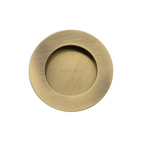 This is an image of a Heritage Brass - Round Flush Pull Antique Brass Finish, c1835-at that is available to order from Trade Door Handles in Kendal.