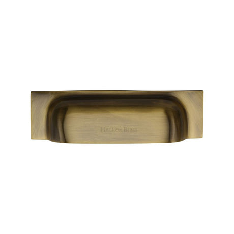 This is an image of a Heritage Brass - Drawer Cup Pull Military Design 96mm CTC Antique Brass Finish, c2766-96-at that is available to order from Trade Door Handles in Kendal.