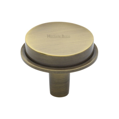 This is an image of a Heritage Brass - Flat Round Knob Design 38 mm Antique Brass finish, c4592-38-at that is available to order from Trade Door Handles in Kendal.