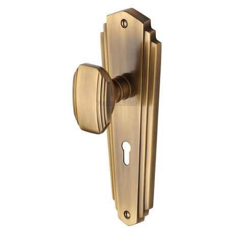 This is an image of a Heritage Brass - Mortice Knob on Lock Plate Charlston Design Antique Brass Finish, cha1900-at that is available to order from Trade Door Handles in Kendal.