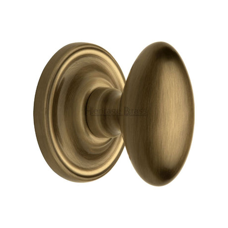 This is an image of a Heritage Brass - Mortice Knob on Rose Chelsea Design Antique Brass Finish, che7373-at that is available to order from Trade Door Handles in Kendal.