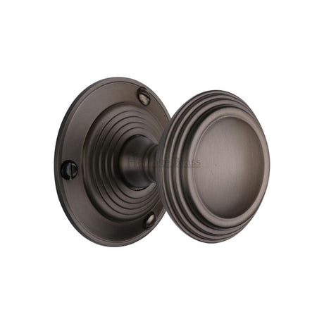 This is an image of a Heritage Brass - Mortice Knob on Rose Goodrich Design Matt Bronze Finish, goo986-mb that is available to order from Trade Door Handles in Kendal.