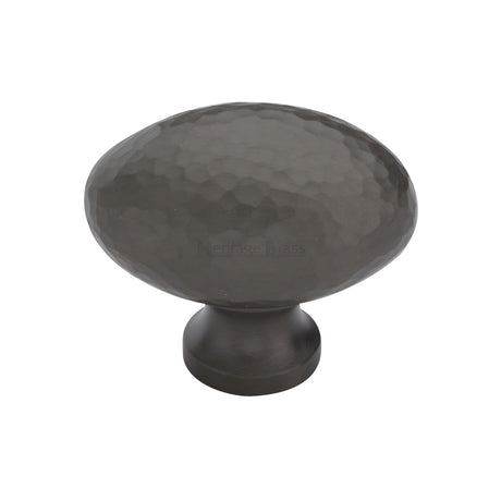 This is an image of a Heritage Brass - Cabinet Knob Victorian Oval Hammered Design 38mm Matt Bronze finish, ham114-38-mb that is available to order from Trade Door Handles in Kendal.